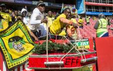 ANC members hold up a make-shift EFF coffin to show their dismay with one of the country's opposition parties at the Siyanqoba rally in Johannesburg on 31 July 2016. Picture: Reinart Toerien/EWN