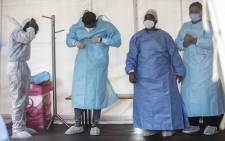 Healthcare workers removing their PPE at the Nasrec Field Hospital in Johannesburg. Picture: Abigail Javier/Eyewitness News
