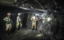 Miners at work in a shaft. Picture: AFP 