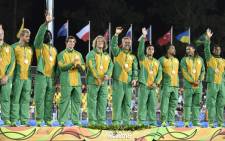 The South African Rugby Sevens team celebrates on the podium during the medal ceremony at the Rio 2016 Olympic Games at Deodoro Stadium in Rio de Janeiro onAugust 11, 2016. Picture: AFP