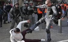 Israeli security forces scuffle with Palestinian protesters just outside Jerusalem's Old City on 15 December 2017. Picture: AFP