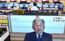 FILE: Television screens show a speech by Japanese Emperor Akihito to the nation while displayed at an electronics shop in Tokyo on 8 August 2016. Picture: AFP