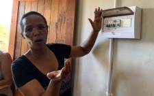 A Delft resident explains that their homes still have no electricity, seven months after the first residents moved into a R33 million housing project in Eindhoven. Picture: Kaylynn Palm/Eyewitness News