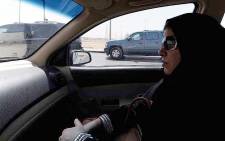 A Saudi woman sits in a vehicle as a passenger. Picture: AFP