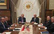 Turkish President Recep Tayyip Erdogan (C-L) and US Vice President Mike Pence (C-R), joined by Secretary of State Mike Pompeo (4R), Turkish Vice President Fuat Oktay (4L), Turkish Foreign Minister Mevlut Cavusoglu (3L) and senior aides, meet at the presidential complex in Ankara, Turkey, on 17 October 2019. Picture: AFP