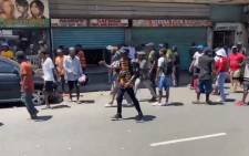 A screenshot of members of the MKMVA  forcefully shutting down all the foreign nationals shops in Durban on 3 November 2020. They demand them to leave the country immediately. Picture: @RiotAndAttackSA/Twitter