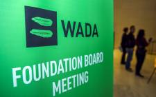 Journalists stands in the lobby of the World Anti-Doping Agency (WADA) foundation board in Baku on 15 November 2018. Picture: AFP.