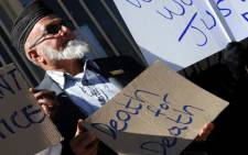 Muslims demonstrate outside the Krugersdorp Magistrate's Court on Monday, 13 August 2012 where two men, accused of assaulting Muslim men in Magaliesburg appeared. Picture: Sapa."