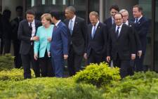 (From left) Italian Prime Minister Matteo Renzi, German Chancellor Angela Merkel, Japanese Prime Minister Shinzo Abe, US President Barack Obama, European Council President Donald Tusk, Canadian Prime Minister Justin Trudeau, French President Francois Hollande, European Commission President Jean-Claude Juncker and British Prime Minister David Cameron walk out to the family photo event during the first day of the Group of Seven (G7) summit meetings in Ise city on May 26, 2016. Picture: AFP.
