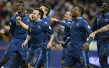 French players celebrate at the end of the FIFA World Cup 2014 qualifying football match against Ukraine,on 19 November 2013 at the Stade de France in Saint-Denis, outside Paris. Picture: AFP
