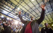 A minister sings and dances during hymns at Lundi Tyamara's memorial in Soweto. Picture: Thomas Holder/EWN