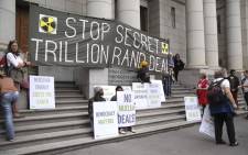 Protesters gathered outside of the Western Cape High Court where it was ruled that government's decision to call for proposals for the procurement of 9.6 gigawatts of nuclear energy is unlawful and unconstitutional. Picture: Cindy Archillies/EWN