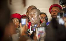 EFF leader Julius Malema addresses members of the media on the Parliamentary steps after the EFF was thrown out of the State of the Nation Address. Picture:Thomas Holder/EWN