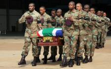 SANDF soldiers carry the bodies of their colleagues killed in the Central African Republic on 24 March 2013. Picture: Alex Eliseev/EWN