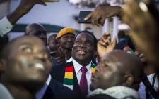 President-elect ED Mnangagwa takes selfies with members of the press at State House, Harare. Picture: Thomas Holder/EWN.