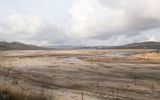 FILE: A shallow stream of water runs through the Theewaterskloof Dam in the Western Cape, as dam levels stand at 14%. Picture: Bertram Malgas/EWN