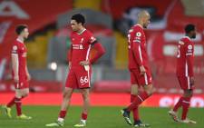 Liverpool's Trent Alexander-Arnold (L) and Fabinho react at the final whistle during the English Premier League football match between Liverpool and Chelsea at Anfield in Liverpool, northwest England on 4 March 2021. Picture: Laurence Griffiths/AFP