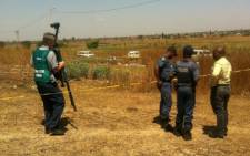 Police on the scene where two bodies of young girls were found in Katlehong, east of Johannesburg. Picture: Reinart Toerien/EWN.