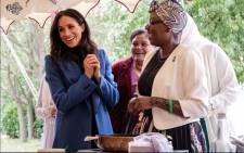 The Duke and Duchess of Sussex and Ms Doria Ragland are celebrating the launch of ‘Together: Our Community Cookbook’ with the women of the Hubb Community Kitchen. Picture: @Kensingtonroyal/Twitter