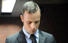 South African Paralympic sprinter Oscar Pistorius appears in the Pretoria Magistrate Court on 20 February 2013. Picture: AFP.