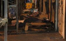 Homeless people sleeping outside a shop in the Joburg CBD. Picture: Taurai Maduna/EWN