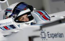 Scottish race driver Susie Wolff sits in her Williams F1 car ahead of Friday's practice session at the 2014 British Grand Prix. Picture: Susie Wolff Official Facebook page.