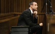 Oscar Pistorius looks on during the fourth day of his trial at the High Court in Pretoria on 6 March 2014. Picture: Pool.