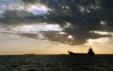 FILE: Generic image of a cargo ship at sunset. Picture: Freeimages.com