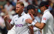 England's James Anderson (R) congratulates England's captain Ben Stokes (L) after bowling to take the wicket of India's Jasprit Bumrah (unseen) on Day 4 of the fifth cricket Test match between England and India at Edgbaston, Birmingham in central England on 4 July 2022. Picture: Geoff Caddick/AFP