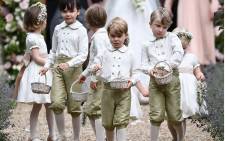 Prince George (front row centre) at the wedding of his aunt Pippa Middleton to James Matthews on 20 May 2017. Picture: AFP.
