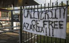 FILE: Protesting students at the University of the Free State placed a banner on a gate close to the entrance of the institution's main campus on 25 February 2016. Picture: Reinart Toerien/EWN.