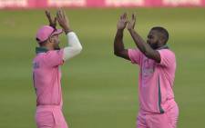 South Africa's Andile Phehlukwayo (R) celebrates with teammate Aiden Markram (L) after the dismissal of Pakistan's Faheem Ashraf (not visible) during the second one-day international (ODI) cricket match between South Africa and Pakistan at Wanderers Stadium in Johannesburg on 4 April 2021. Picture: Christiaan Kotze/AFP