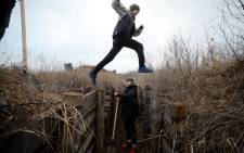 Ukrainian teenagers dig trenches for soldiers serving on their country's eastern front and facing off with Russian-backed separatists on 11 February 2022.