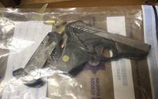 FILE: A gun and ammunition confiscated by the police. Picture: Saps