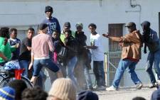 Illegal migrants in the French port city of Calais protested on Friday over what they said was police violence and worsening humanitarian conditions. Picture: AFP.