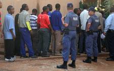 Some of the arrested Lonmin mineworkers preparing to appear in the Ga-Rankuwa Magistrate’s Court on 3 September, 2012. Picture: Taurai Maduna.