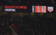 FILE: The scoreboard displays the 0-5 scoreline late on during the English Premier League football match between Manchester United and Liverpool at Old Trafford in Manchester, north west England, on 24 October 2021. Picture: Oli SCARFF / AFP