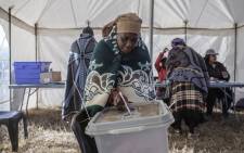 A Mosotho woman casts her ballot, at a polling station in Maseru, during Lesotho's general election. Picture: AFP