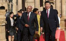 Chinese President Xi Jinping (R) and South African President Jacob Zuma (L) arrive for a meeting after the arrival ceremony of the Chinese President, at the Union Buildings in Pretoria, during the start of his official tour to South Africa on December 2, 2015. Picture: AFP