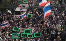 Thai anti-government protesters march in the streets during a rally in Bangkok on 23 January, 2014. Defiant Thai opposition protesters vowed to ignore a state of emergency that came into force across the tense capital on 22 January, refusing to abandon their fight to bring down the government. Picture: AFP.