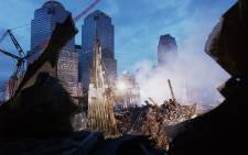 Early morning light illuminates the wreckage of the World Trade Center 25 September, 2001 in New York. Picture: AFP