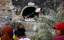 Villagers and locals gather to look at the efforts by the operatives to rescue the 41 men trapped inside the collapsed under construction Silkyara tunnel in the Uttarkashi district of India's Uttarakhand state on 28 November 2023. Picture:  Sajjad HUSSAIN / AFP