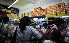 FILE: Parents purchasing school uniforms and supplies for their children the day before schools reopen. Picture: Abigail Javier/EWN
