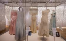 Dresses made by desinger Catherine Walker in 1987 (2L), and Gina Fratini in 1990 (2R), worn by worn by Britain's Diana, Princess of Wales in Hong Kong in 1989. Picture: AFP 