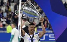 FILE: Real Madrid midfielder Casemiro celebrates with the trophy after the UEFA Champions League final football match between Liverpool and Real Madrid at the Stade de France in Saint-Denis, north of Paris, on 18 May 2022. Real Madrid won the match 1-0. Picture: JAVIER SORIANO / AFP