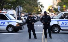 Police officers secure an area following a shooting incident in New York on 31 October, 2017. Picture: AFP