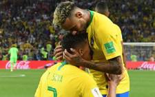 Brazil's defender Thiago Silva is congratulated on his goal by Brazil's forward Neymar during the Russia 2018 World Cup Group E football match between Serbia and Brazil at the Spartak Stadium in Moscow on 27 June, 2018. Picture: AFP.