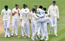 South Africa's paceman Lutho Sipamla (3rd R) celebrates the dismissal of New Zealand's Devon Conway with his teammates on day five of the second cricket Test match between New Zealand and South Africa at Hagley Oval in Christchurch on 1 March 2022. Picture: Sanka Vidanagama/AFP