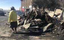 FILE: Residents of Alexandra try to salvage what's left of their belongings, after a fire that left at least 120 families homeless and killed a 16-month-old baby boy. Picture: Kgothatso Mogale/EWN