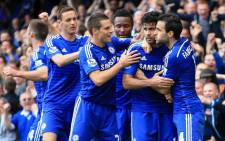 FILE: Chelsea players huddle together to celebrate with tema mate Diego Costa after scoring the second goal against Arsenal in the English Premier League on 5 October 2014. Picture: Official Chelsea Facebook page.
